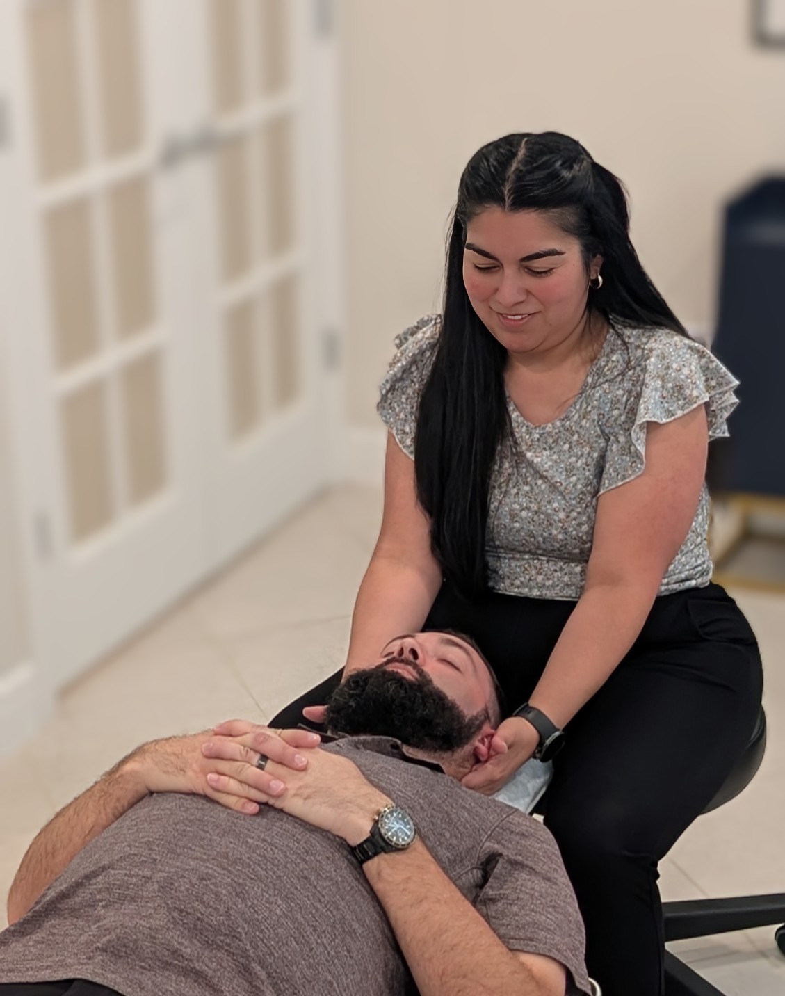Chiropractor performing a gentle spinal adjustment