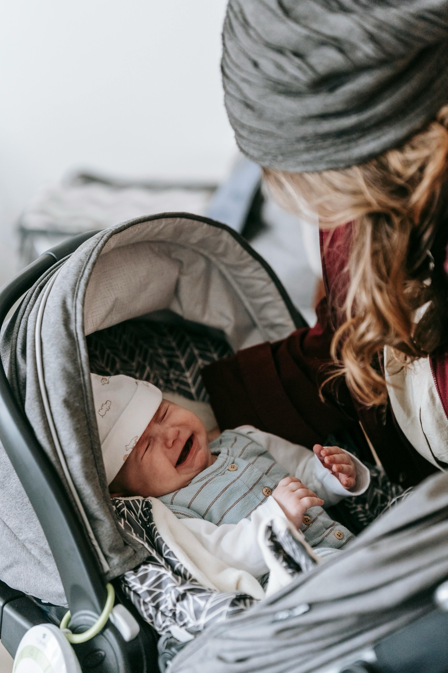 Newborn crying in an infant car seat