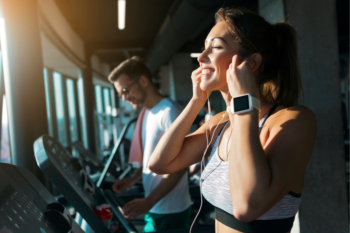 Woman running on a treadmill at the gym